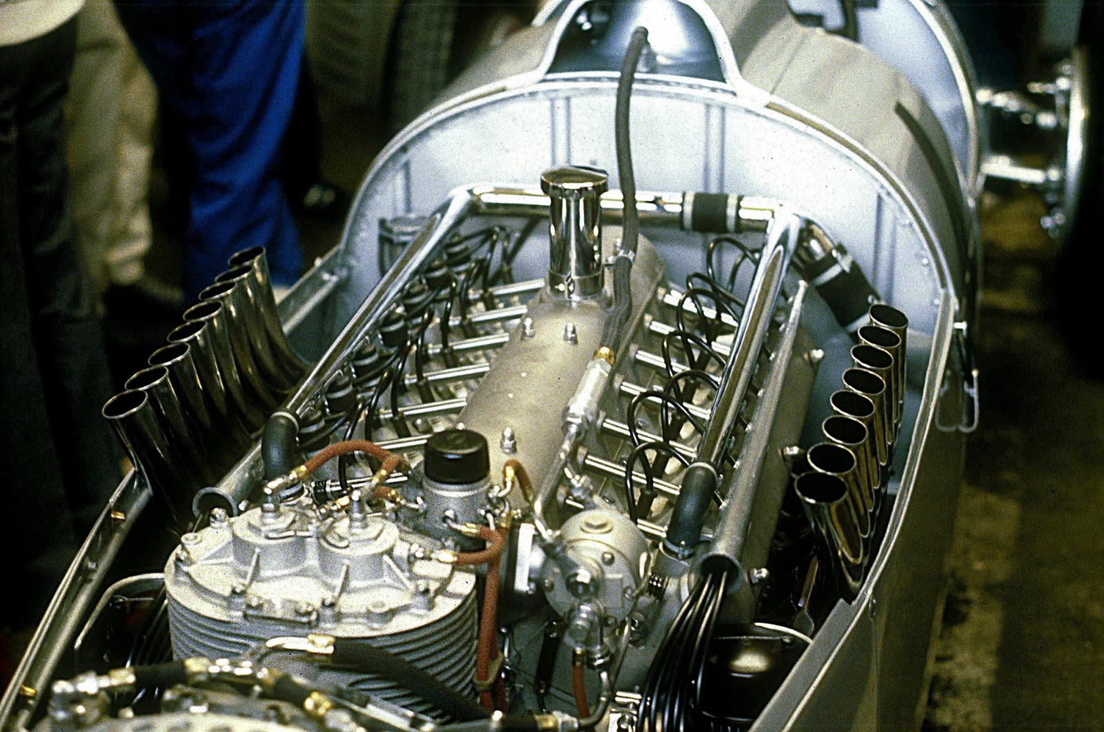 The V16 engine of an Auto Union Type C seen from behind, with its two banks of exhaust stubs, plug leads and supercharger casing