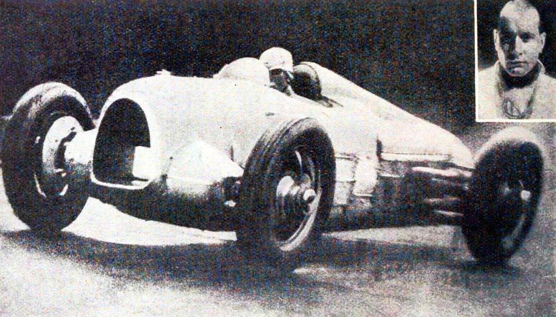 A short-tailed Auto Union with twin rear wheels cornering on a hill-climb road, with an inset portrait of a driver
