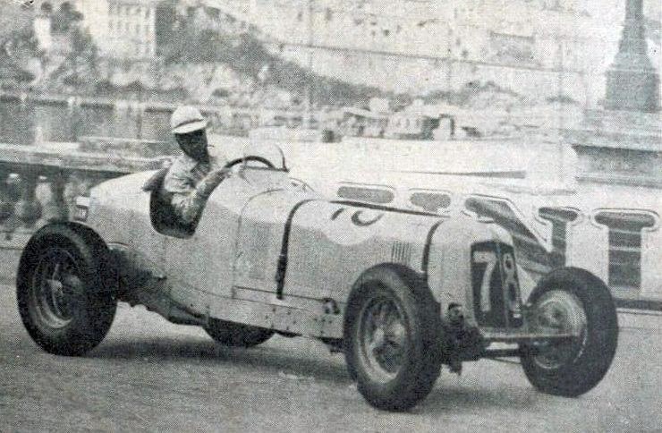 Prince Bira, in a white helmet, drives the ERA R2B Romulus, number 78, past the harbour wall at Monaco