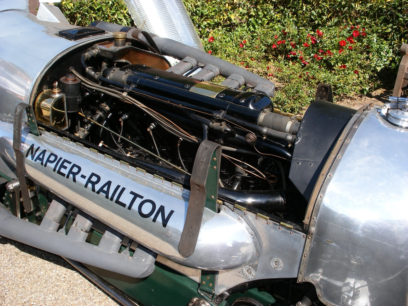 The Napier Lion W12 engine of the Napier-Railton with its side panel removed, showing the cylinder banks, pipework and the NAPIER-RAILTON name on the cowling