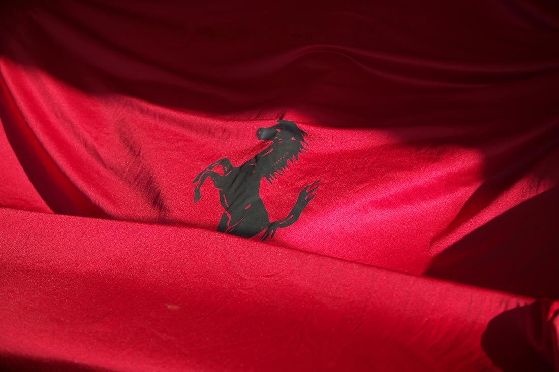Ex- Gilles Velleneuve Ferrrari F1 car under a dust cover after a day