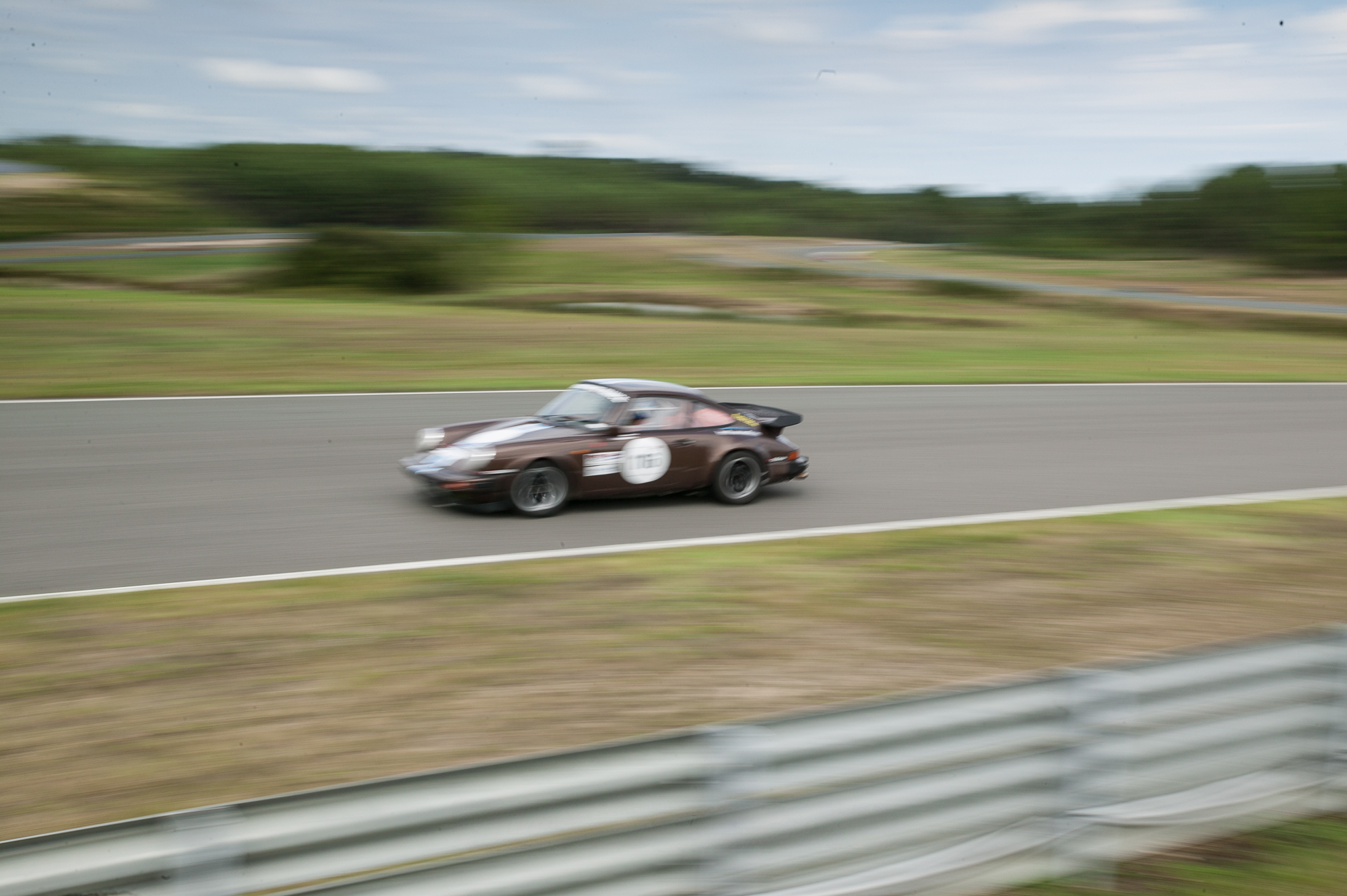 Fast downhill past the pitlane
